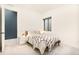 Cozy bedroom with a queen-sized bed, modern decor, and natural light at 1983 S Logan St, Denver, CO 80210