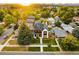 Daytime aerial view of a modern two-story home featuring professional landscaping, a well-kept yard, and neighborhood at 1983 S Logan St, Denver, CO 80210