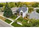 Daytime aerial view of a modern two-story home with a landscaped yard and inviting front entrance at 1983 S Logan St, Denver, CO 80210