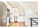Contemporary kitchen design with stainless steel appliances, white cabinetry, modern fixtures, and hardwood floors at 1983 S Logan St, Denver, CO 80210