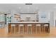 Bright, open kitchen features a large island with seating and modern lighting at 1983 S Logan St, Denver, CO 80210
