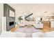 Open living area with modern fireplace, hardwood floors, and comfortable seating at 1983 S Logan St, Denver, CO 80210