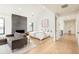 Spacious main bedroom featuring a fireplace, vaulted ceilings, hardwood floors, and ample natural light at 1983 S Logan St, Denver, CO 80210