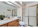 Functional bathroom with a shower, white tiles, and well-maintained fixtures, offering a clean and practical space at 4240 S Yukon Way, Lakewood, CO 80235