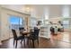 Cozy dining area with backyard access and open-concept design at 4240 S Yukon Way, Lakewood, CO 80235