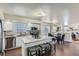 Open kitchen features modern appliances, a center island, and seamless flow to the living spaces at 4240 S Yukon Way, Lakewood, CO 80235