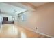 Spacious living room with hardwood floors and great natural light from multiple windows at 4240 S Yukon Way, Lakewood, CO 80235