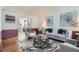 Cozy living room with modern decor, stylish rug, and comfortable seating arrangement at 4240 S Yukon Way, Lakewood, CO 80235