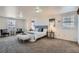 Large Primary suite featuring soft carpeting, ample natural light, and a calming, spacious atmosphere at 4240 S Yukon Way, Lakewood, CO 80235