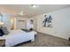 Spacious Primary bedroom with neutral carpet and an ensuite bathroom at 4240 S Yukon Way, Lakewood, CO 80235