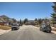 Street view of the house showing its location and surrounding neighborhood at 4240 S Yukon Way, Lakewood, CO 80235