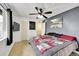 This bedroom is carpeted and features a door to the stairway at 1212 S Uvalda St, Aurora, CO 80012