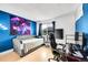 This bedroom features a modern color scheme and layout with a unique galaxy tapestry at 1212 S Uvalda St, Aurora, CO 80012