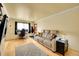 Cozy living room with hardwood floors, and a modern sofa at 1212 S Uvalda St, Aurora, CO 80012
