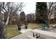 Community backyard featuring two BBQ grills, picnic table and seating area at 3450 S Poplar St # 307, Denver, CO 80224