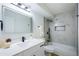 Modern bathroom featuring marble-style tile, sleek black fixtures, and a shower-tub combination at 3450 S Poplar St # 307, Denver, CO 80224
