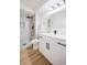 Stylish bathroom featuring a modern vanity, shower with sleek black fixtures, and marble-look tile at 3450 S Poplar St # 307, Denver, CO 80224