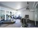Well-equipped gym featuring treadmills, stationary bikes, weights and mirrored walls at 3450 S Poplar St # 307, Denver, CO 80224