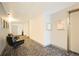 Clean hallway features seating, artwork and community bulletin board at 3450 S Poplar St # 307, Denver, CO 80224