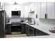 Modern kitchen with stainless steel appliances, quartz counters and sleek cabinetry at 3450 S Poplar St # 307, Denver, CO 80224