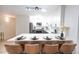Modern kitchen with white cabinets, stainless appliances and bar-style seating at 3450 S Poplar St # 307, Denver, CO 80224