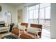 Relaxing living room with outdoor access to a private balcony and comfortable seating arrangement at 3450 S Poplar St # 307, Denver, CO 80224