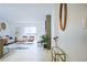 Open-concept living room with wood floors, lots of light, modern furniture and decor at 3450 S Poplar St # 307, Denver, CO 80224