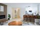 Spacious living area featuring modern kitchen, fireplace and an open concept layout at 3450 S Poplar St # 307, Denver, CO 80224