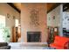 Inviting living room with brick fireplace, unique metal art, and comfortable seating area at 3450 S Poplar St # 307, Denver, CO 80224