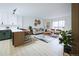 Open floor plan showcasing kitchen, dining area, and living room with modern decor at 3450 S Poplar St # 307, Denver, CO 80224