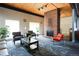 Comfortable lounge area featuring brick fireplace and cozy seating, perfect for relaxation and socializing at 3450 S Poplar St # 307, Denver, CO 80224
