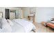 Inviting primary bedroom featuring a bench, queen size bed, and an ensuite bathroom at 3450 S Poplar St # 307, Denver, CO 80224