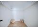 A clean walk-in closet with organizers, shelves, and a cozy textured floor cushion at 3450 S Poplar St # 307, Denver, CO 80224