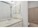 Bathroom featuring a vanity with sink and a shower-tub combo with tile surround at 921 S Zeno Way # 201, Aurora, CO 80017