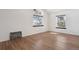 Bright bedroom with wood floors, two windows, and natural light at 921 S Zeno Way # 201, Aurora, CO 80017