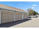 Three garage units in a row outside the home, showing garage doors and house numbers at 921 S Zeno Way # 201, Aurora, CO 80017
