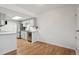 Bright kitchen with white cabinets, stainless steel appliances, and hardwood floors at 921 S Zeno Way # 201, Aurora, CO 80017