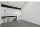 Loft area featuring gray carpet and railing overlooking the living area at 921 S Zeno Way # 201, Aurora, CO 80017