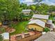 Beautiful backyard showcases lush lawn, garden beds, patio, fire pit, and mature trees at 12625 W 66Th Cir, Arvada, CO 80004