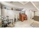 Finished basement featuring a desk, guitars, a drum set, and a neon sign at 12625 W 66Th Cir, Arvada, CO 80004