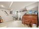 Finished basement featuring a desk, guitars, a drum set, and a neon sign at 12625 W 66Th Cir, Arvada, CO 80004