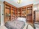 Cozy bedroom features custom built-in bookshelves, creating a stylish and functional space with warm tones at 12625 W 66Th Cir, Arvada, CO 80004