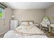 Bright bedroom with a decorative chandelier, window for natural light, and a cozy desk area at 12625 W 66Th Cir, Arvada, CO 80004