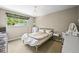 Bright bedroom with a decorative chandelier, window for natural light, and a cozy desk area at 12625 W 66Th Cir, Arvada, CO 80004