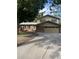Charming two-story home with a brick facade, attached two-car garage, and spacious driveway at 12625 W 66Th Cir, Arvada, CO 80004