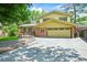 Lovely two-story home with a well-maintained lawn, brick accents, and a convenient attached two car garage at 12625 W 66Th Cir, Arvada, CO 80004