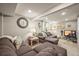 Comfortable living room boasts a large sectional sofa, recessed lighting, and cozy decor at 12625 W 66Th Cir, Arvada, CO 80004