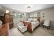 Inviting main bedroom with a bench seat, windows for natural light, and ample closet space at 12625 W 66Th Cir, Arvada, CO 80004