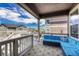 Inviting covered deck with comfortable seating, offering a perfect outdoor relaxation spot at 23957 E Rocky Top Ave, Aurora, CO 80016