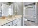 Bright bathroom features a single sink vanity and a combined shower and bathtub at 23957 E Rocky Top Ave, Aurora, CO 80016
